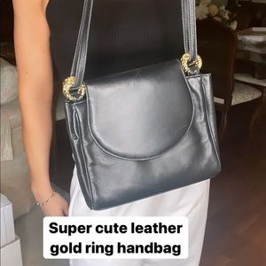 Gold and black leather bag